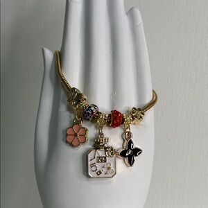 Gold Charm Bracelet with Colorful Beads and Butterfly Charm